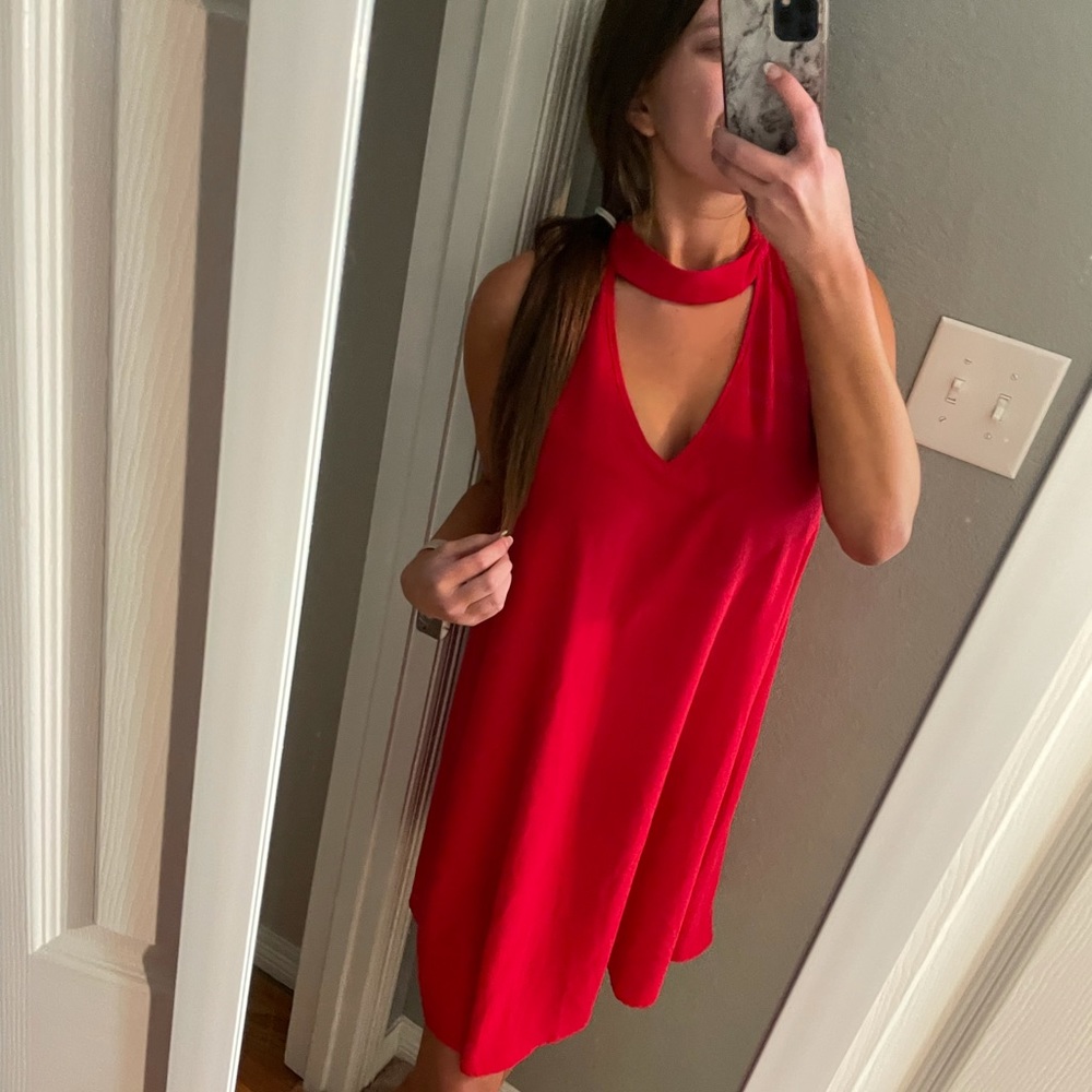 Red casual dress with neck cutout. Size: Medium